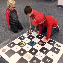 Students discovered that coding with robots takes patience to get the routes to work.